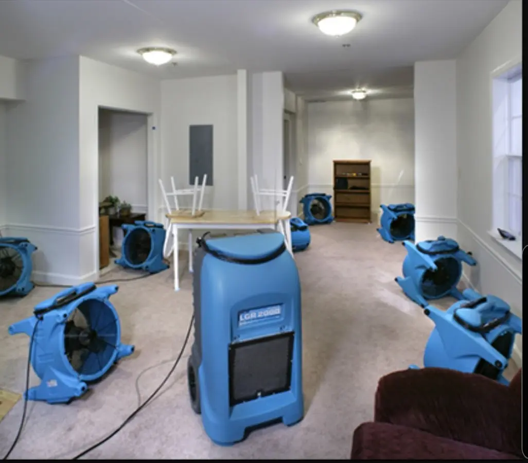 Air movers and dehumidifier setup for Water Damage Restoration in Plainview